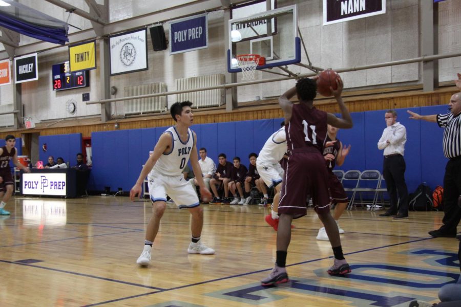 Senior Nolan Young during the boys varsity basketball game. 