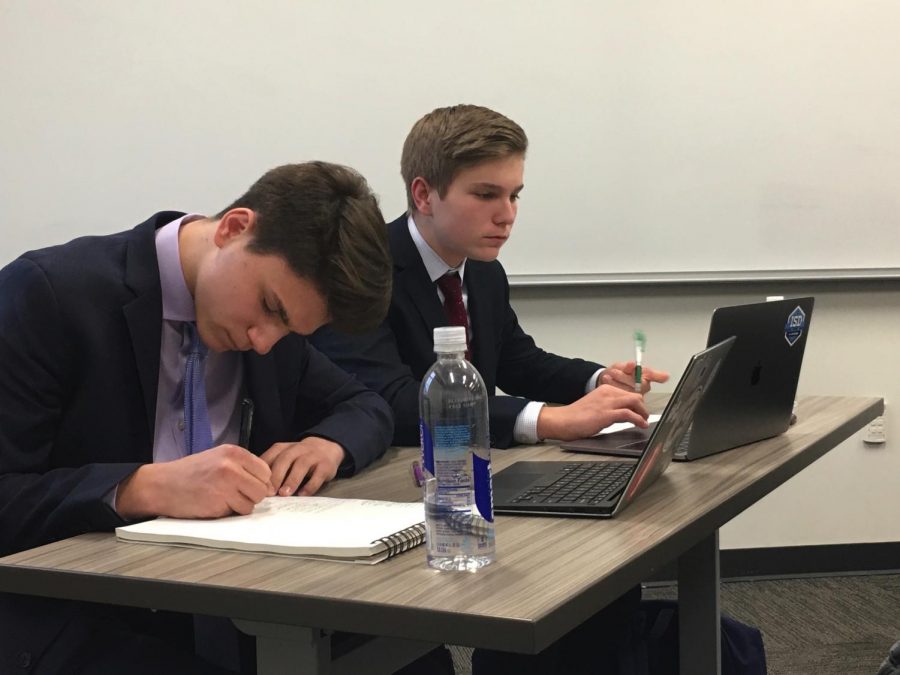 Seniors and debate champions Dominic and Harrison Scholssberg prepare for a round. 