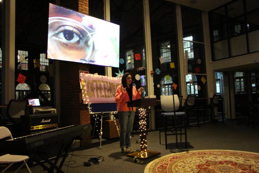 Junior Alexandra Nava-Baltimore presents here photography at the first Coffee House.