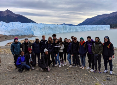 The students on the trip pose in front of the glaciers in Patagonia.