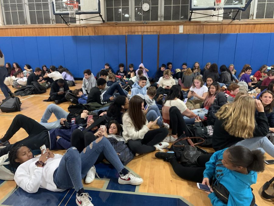 Sophomore and Junior students make themselves comfortable during their two hour stay in the Legacy gym.